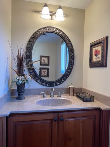 a bathroom with a sink and a mirror