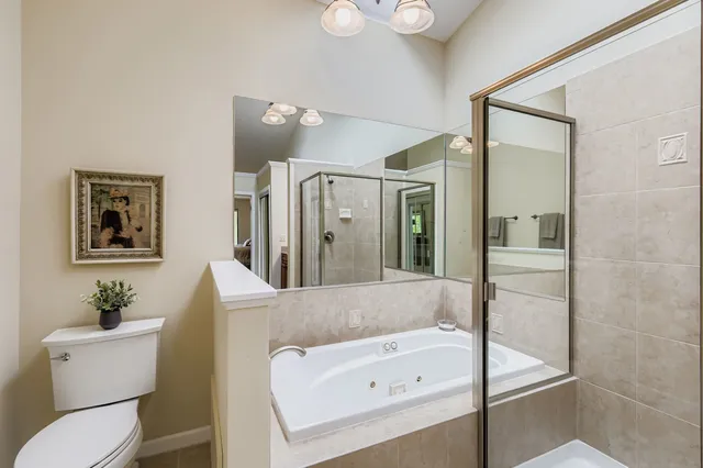 a bathroom with a tub and a shower