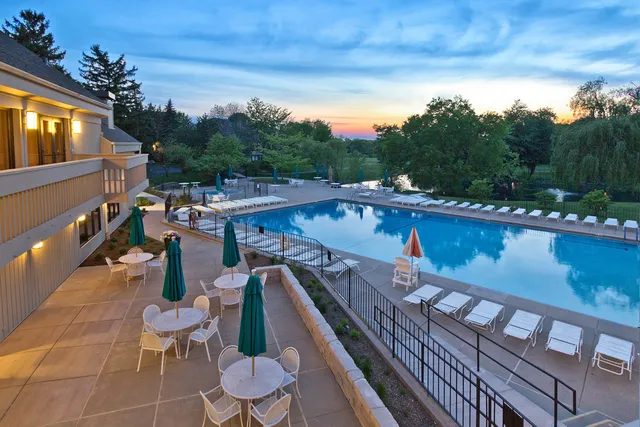 a view of a balcony with chairs