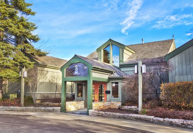 a view of a swimming pool with a yard