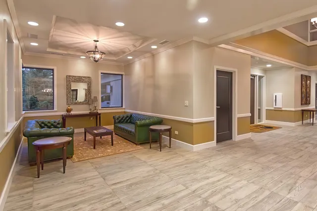 a view of a lobby with furniture and a chandelier
