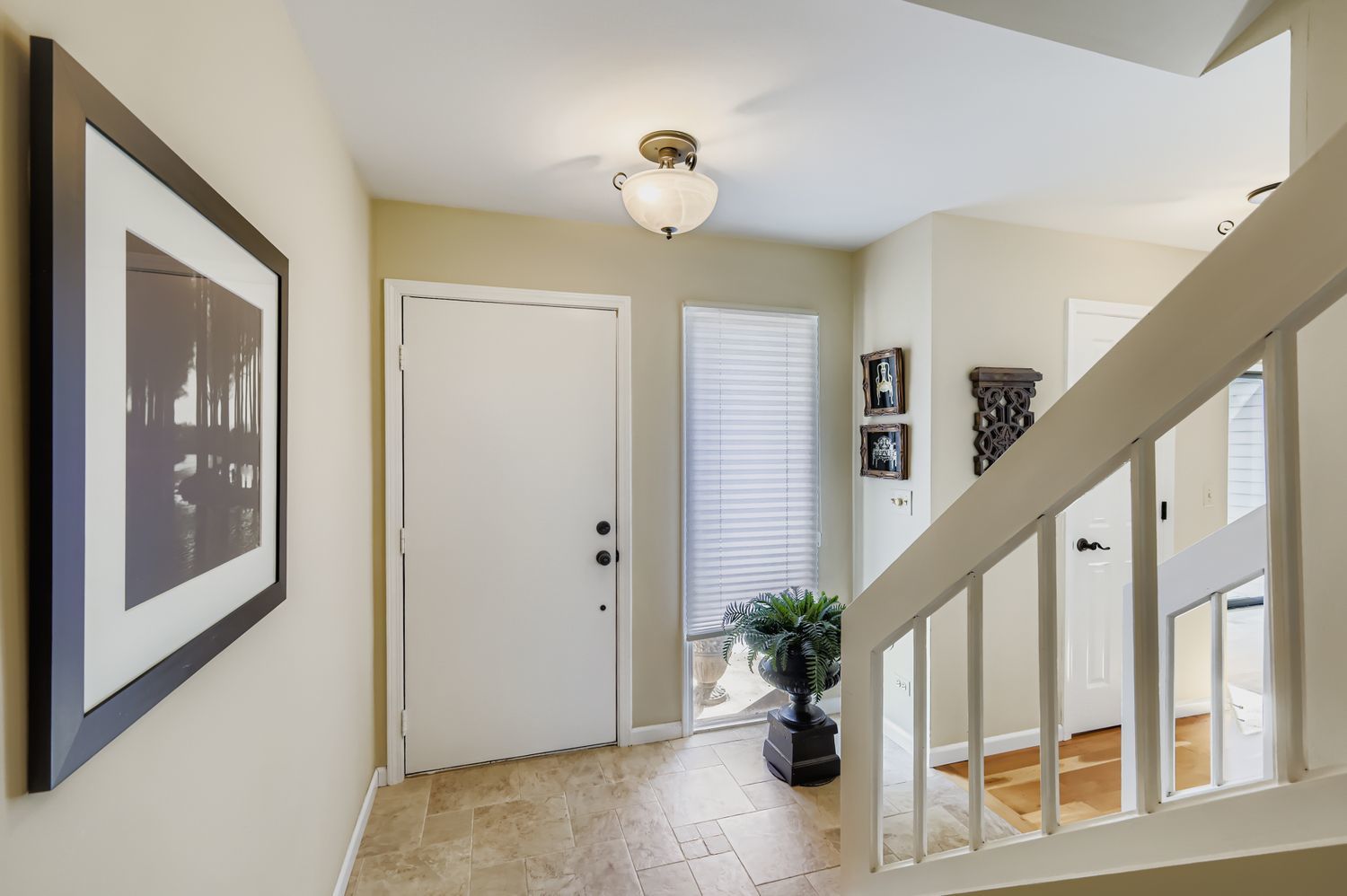 668 Shoreline Road Lake Barrington, IL 60010 - Photo 5 of 53 a view of entryway with paintings on the walls