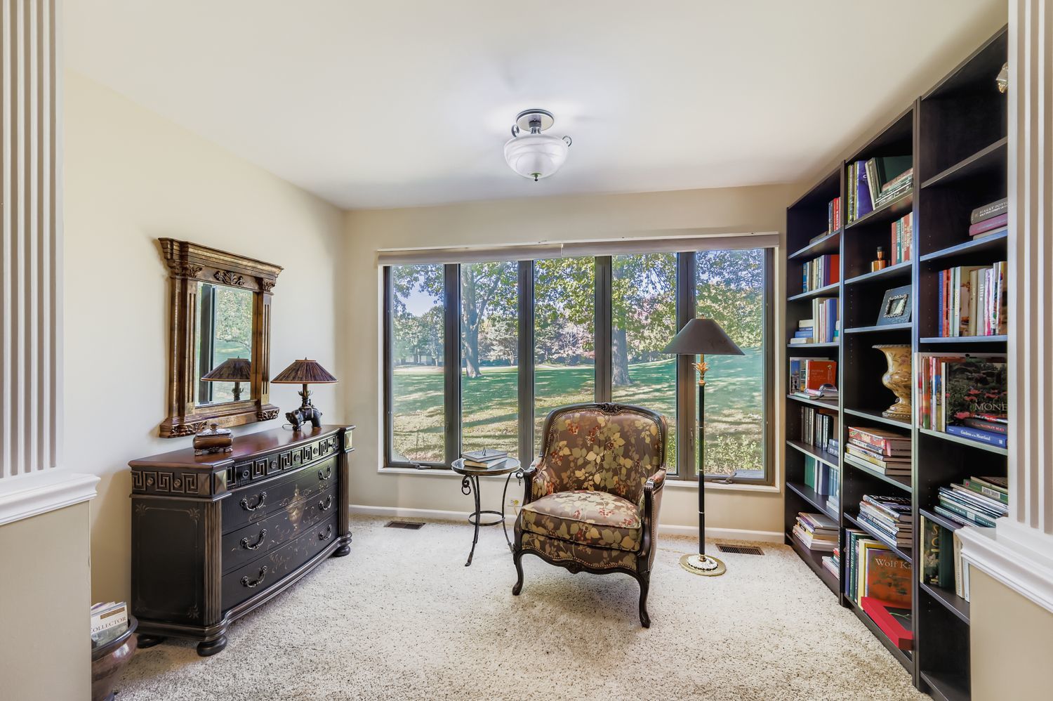 668 Shoreline Road Lake Barrington, IL 60010 - Photo 10 of 53 a living room with furniture a rug and a book shelf