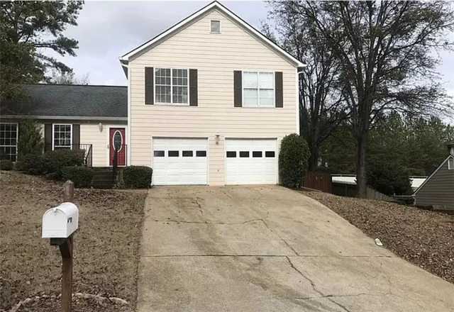 a front view of a house with a yard