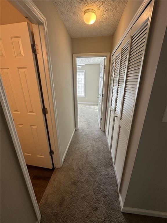 3993 Paloverde Drive Kennesaw, GA 30144 - Photo 18 of 25 a view of a hallway with white walls and stairs