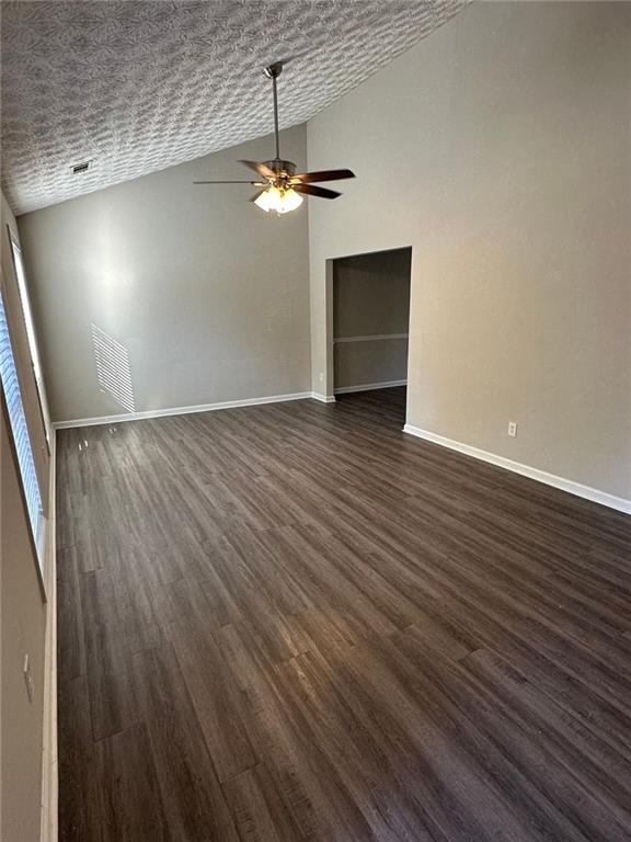 3993 Paloverde Drive Kennesaw, GA 30144 - Photo 2 of 25 an empty room with wooden floor chandelier and windows