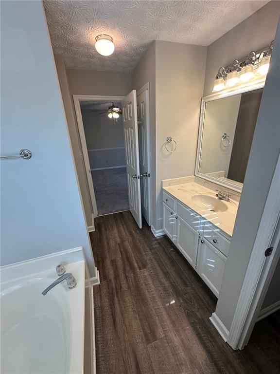 3993 Paloverde Drive Kennesaw, GA 30144 - Photo 23 of 25 a bathroom with a double vanity sink and mirror with shower