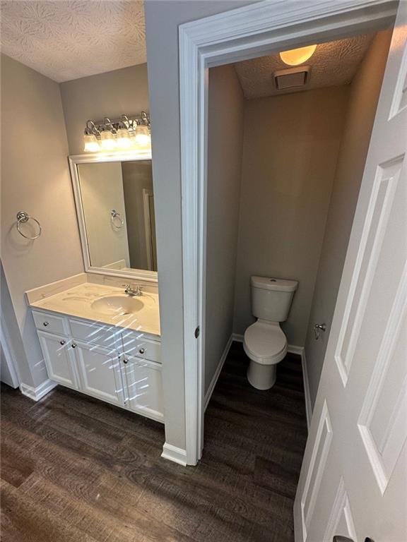 3993 Paloverde Drive Kennesaw, GA 30144 - Photo 24 of 25 a bathroom with a granite countertop sink toilet and mirror