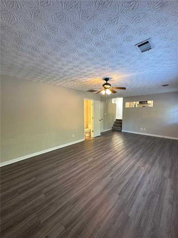 3993 Paloverde Drive Kennesaw, GA 30144 - Photo 8 of 25 wooden floor in an empty room with a window