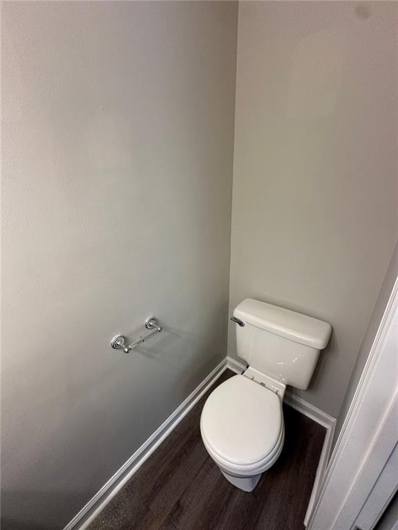 3993 Paloverde Drive Kennesaw, GA 30144 - Photo 10 of 25 a white toilet sitting in a bathroom