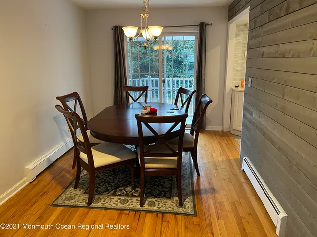 a living room with furniture a rug and a flat screen tv