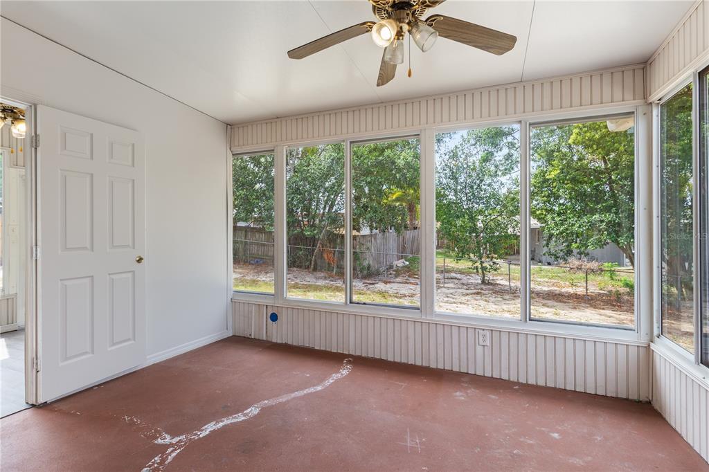7208 Fair Oaks Street Spring Hill, FL 34606 - Photo 17 of 25 a view of an empty room with a window