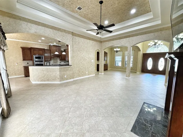 a living room with granite countertop furniture and a fireplace