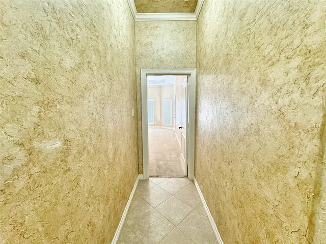 wooden floor in an empty room with a ceiling fan