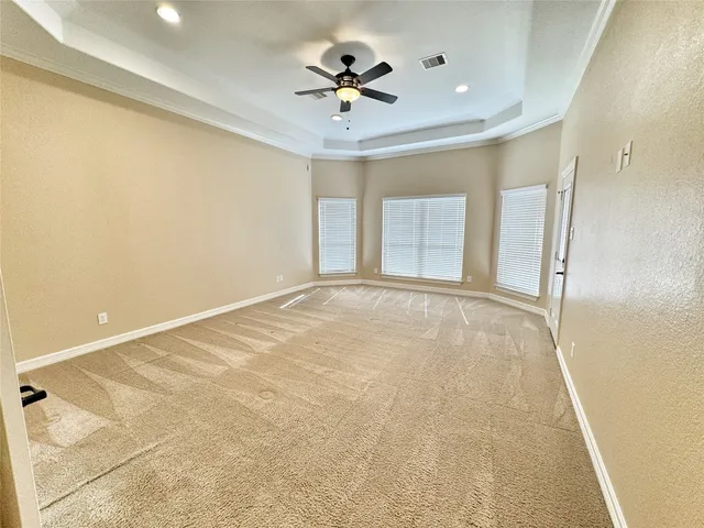 a view of a livingroom with a ceiling fan