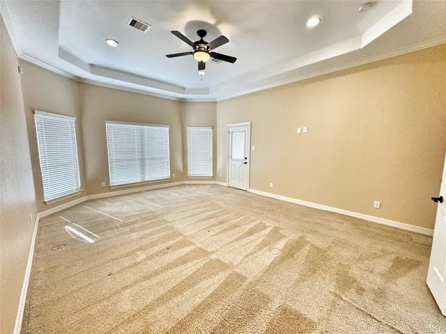 a spacious bathroom with a double vanity sink a mirror and a bathtub
