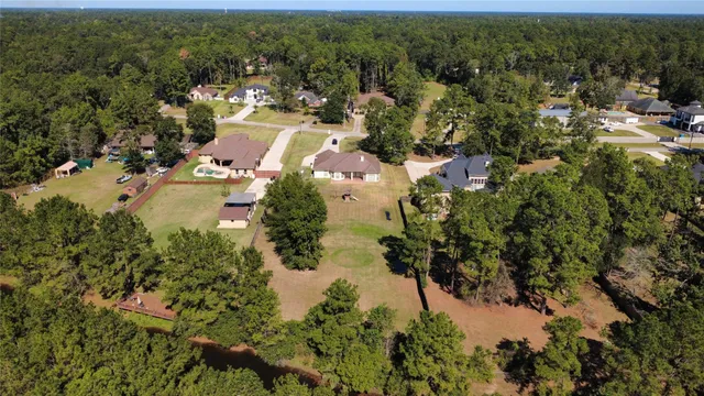 an aerial view of a house with a swimming pool