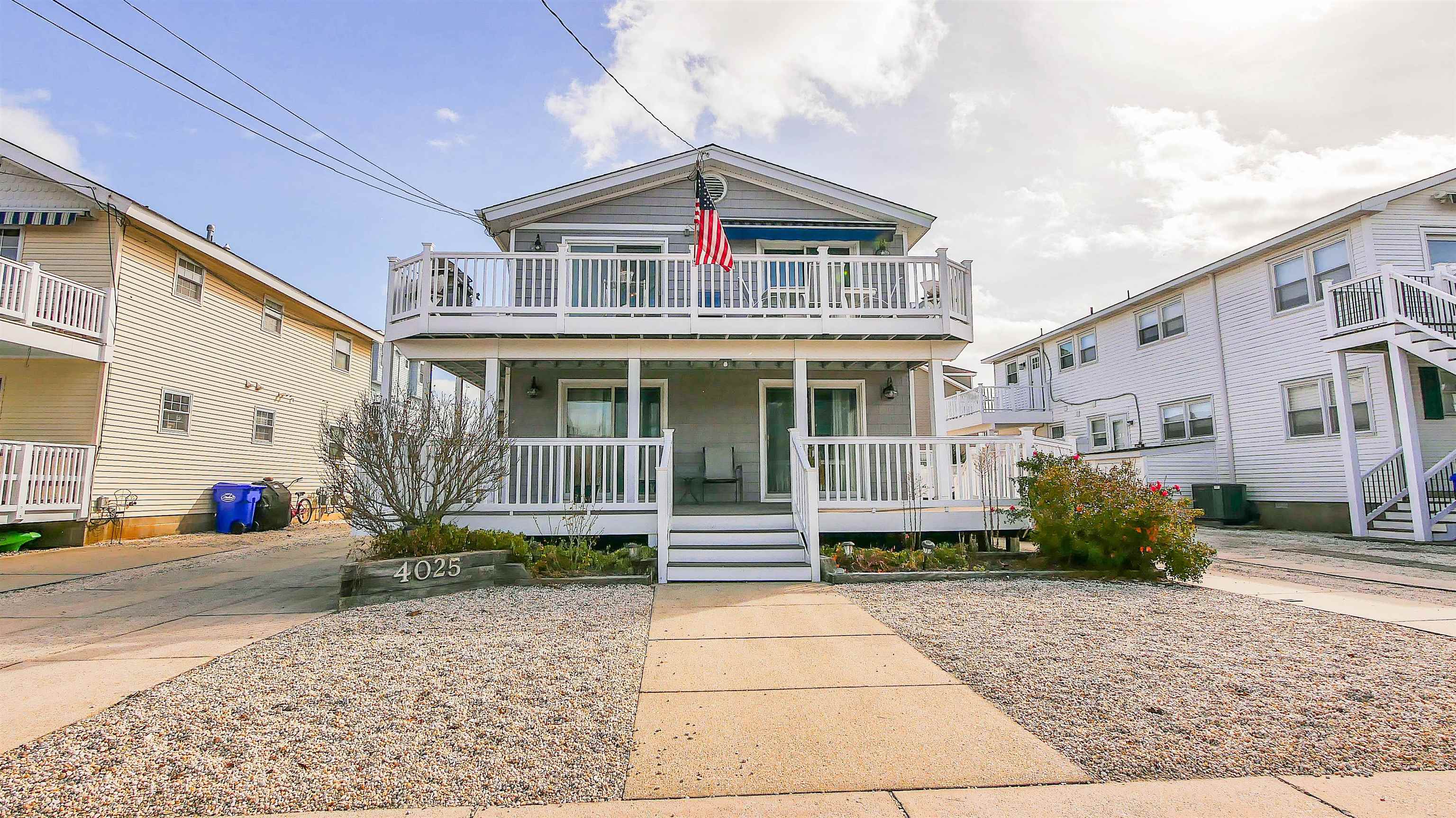 4025 4th, Unit TOP Avalon, NJ 08202 - Photo 1 of 32 a front view of a house with garden