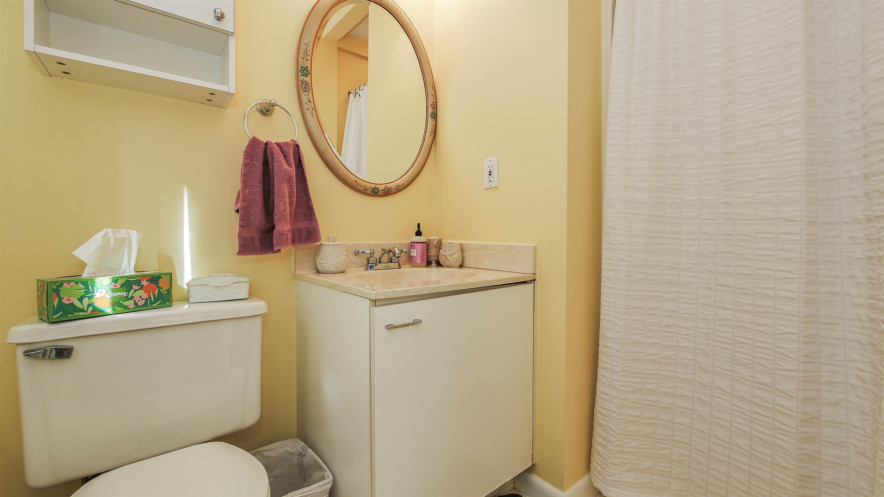4025 4th, Unit TOP Avalon, NJ 08202 - Photo 19 of 32 a bathroom with a sink mirror vanity and toilet