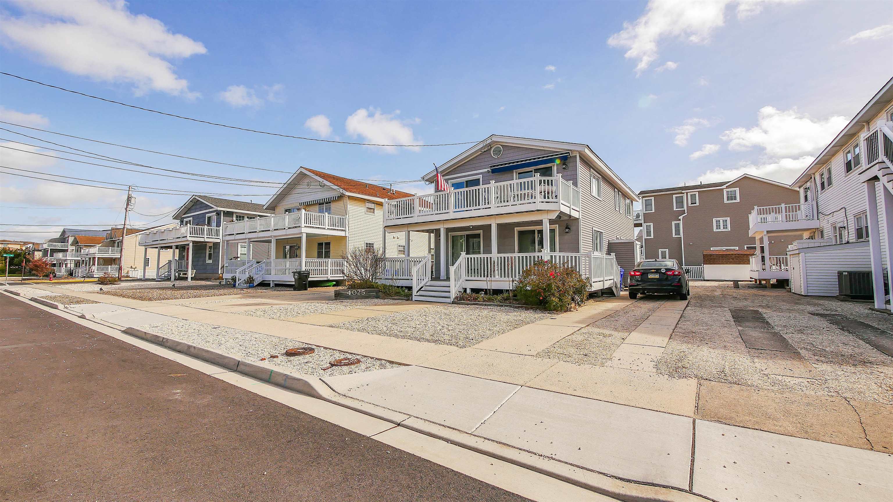 4025 4th, Unit TOP Avalon, NJ 08202 - Photo 3 of 32 a front view of residential houses with yard