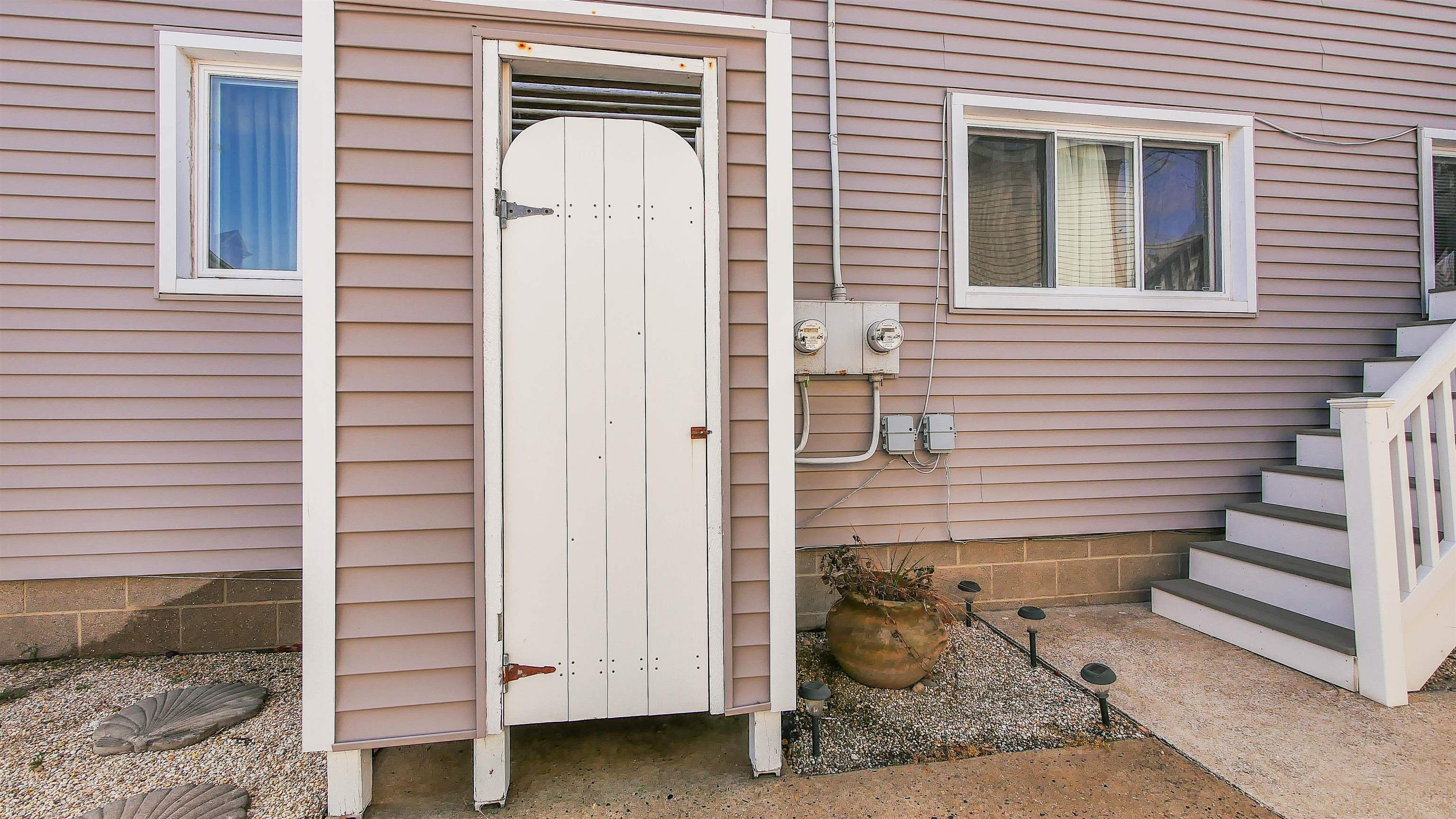 4025 4th, Unit TOP Avalon, NJ 08202 - Photo 5 of 32 a front view of a house with stairs