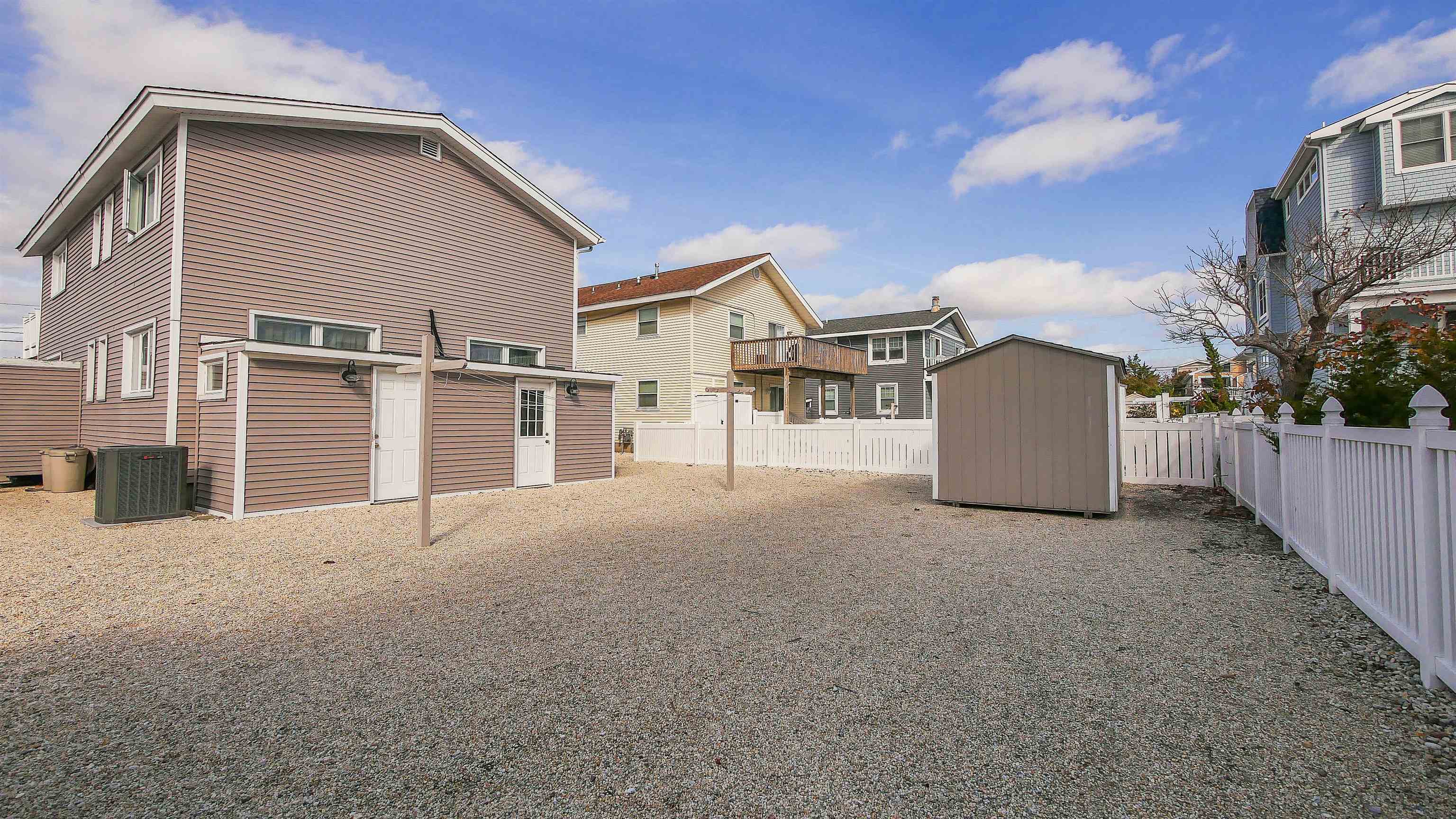 4025 4th, Unit TOP Avalon, NJ 08202 - Photo 6 of 32 a view of a house with a backyard