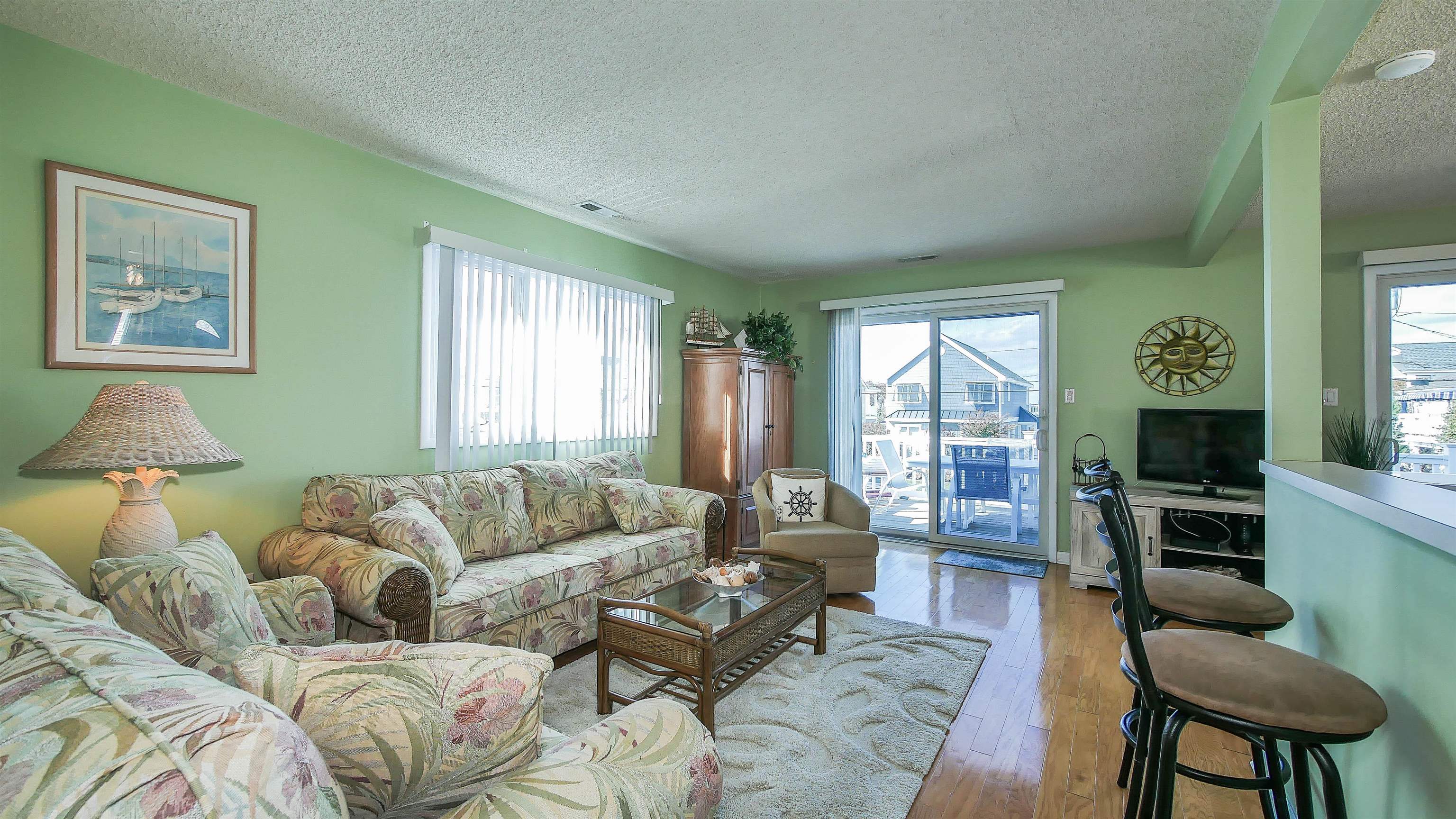 4025 4th, Unit TOP Avalon, NJ 08202 - Photo 9 of 32 a living room with furniture and a large window