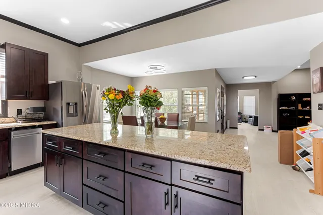 a view of a kitchen counter top space cabinets and stainless steel appliances