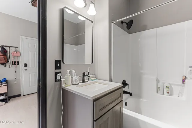 a bathroom with a sink and a mirror