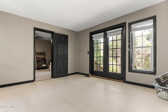 a view of an empty room with a window