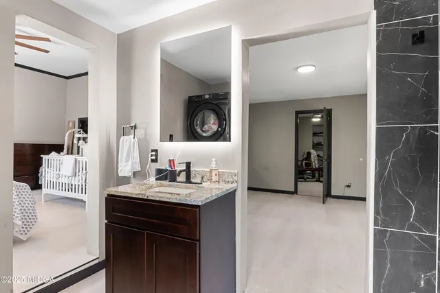 a bathroom with a glass shower door