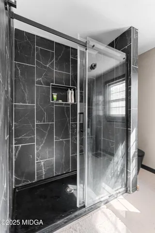 a backyard of a house with table and chairs