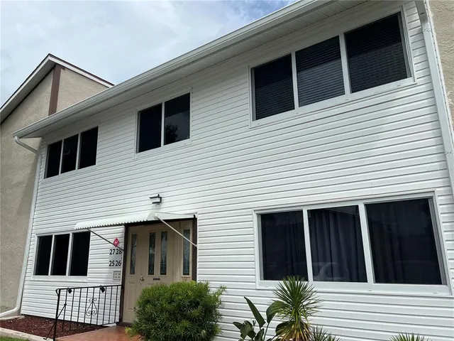 a view of a house with many windows