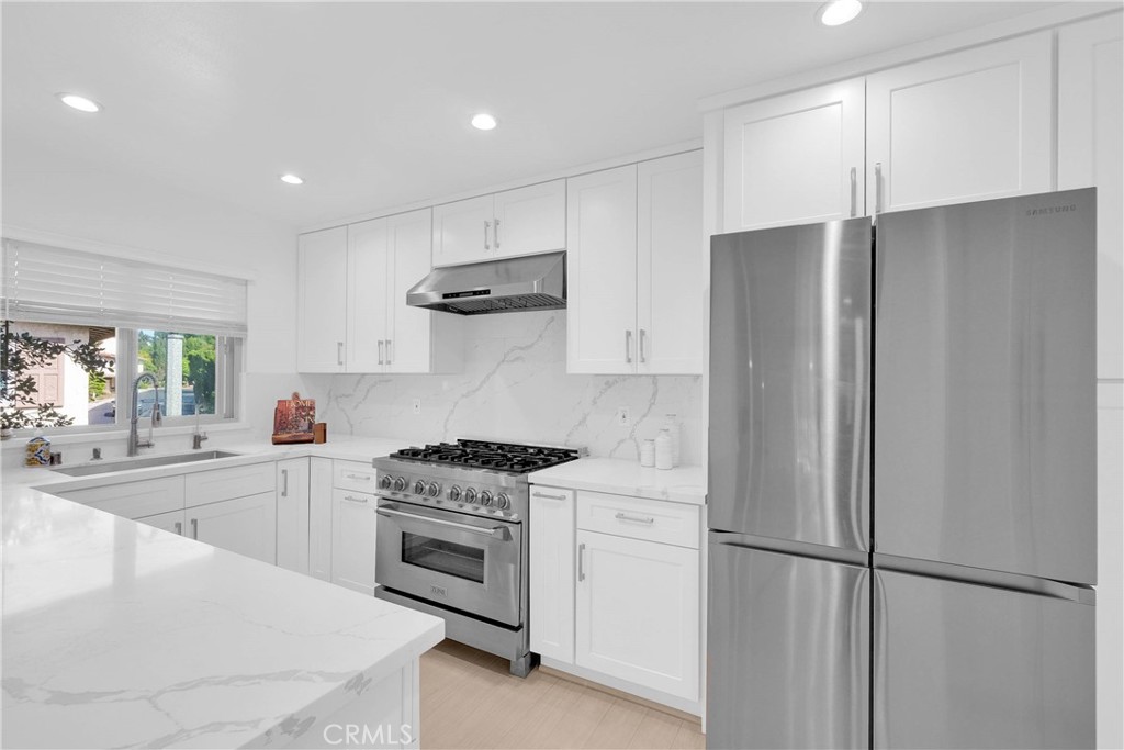 28127 Ridgethorne Court Rancho Palos Verdes, CA 90275 - Photo 16 of 36 a kitchen with a stove a refrigerator and a sink