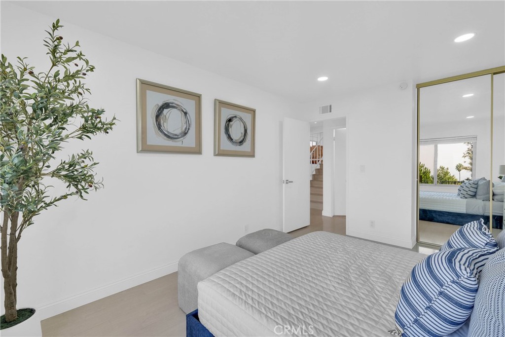 28127 Ridgethorne Court Rancho Palos Verdes, CA 90275 - Photo 24 of 36 a bedroom with a bed and a couch