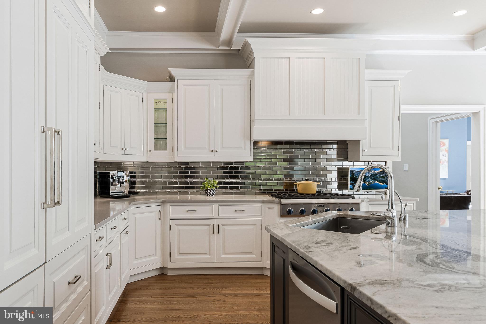 1210 Windrock Drive McLean, VA 22102 - Photo 11 of 84 a kitchen with granite countertop white cabinets and white appliances
