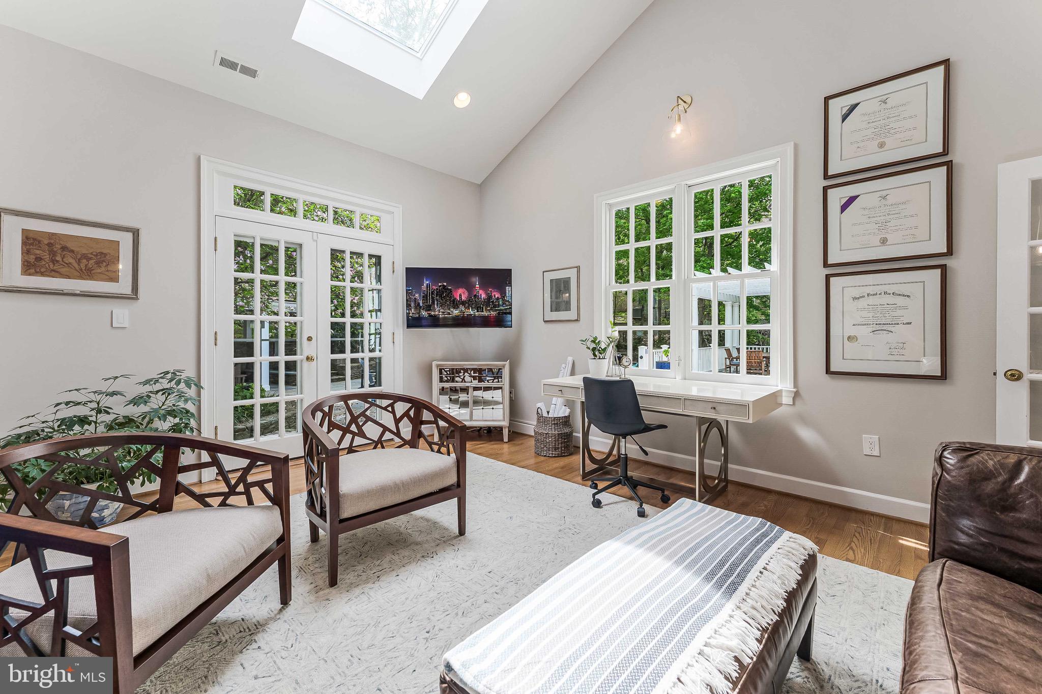 1210 Windrock Drive McLean, VA 22102 - Photo 20 of 84 a living room with furniture floor to ceiling window and a table