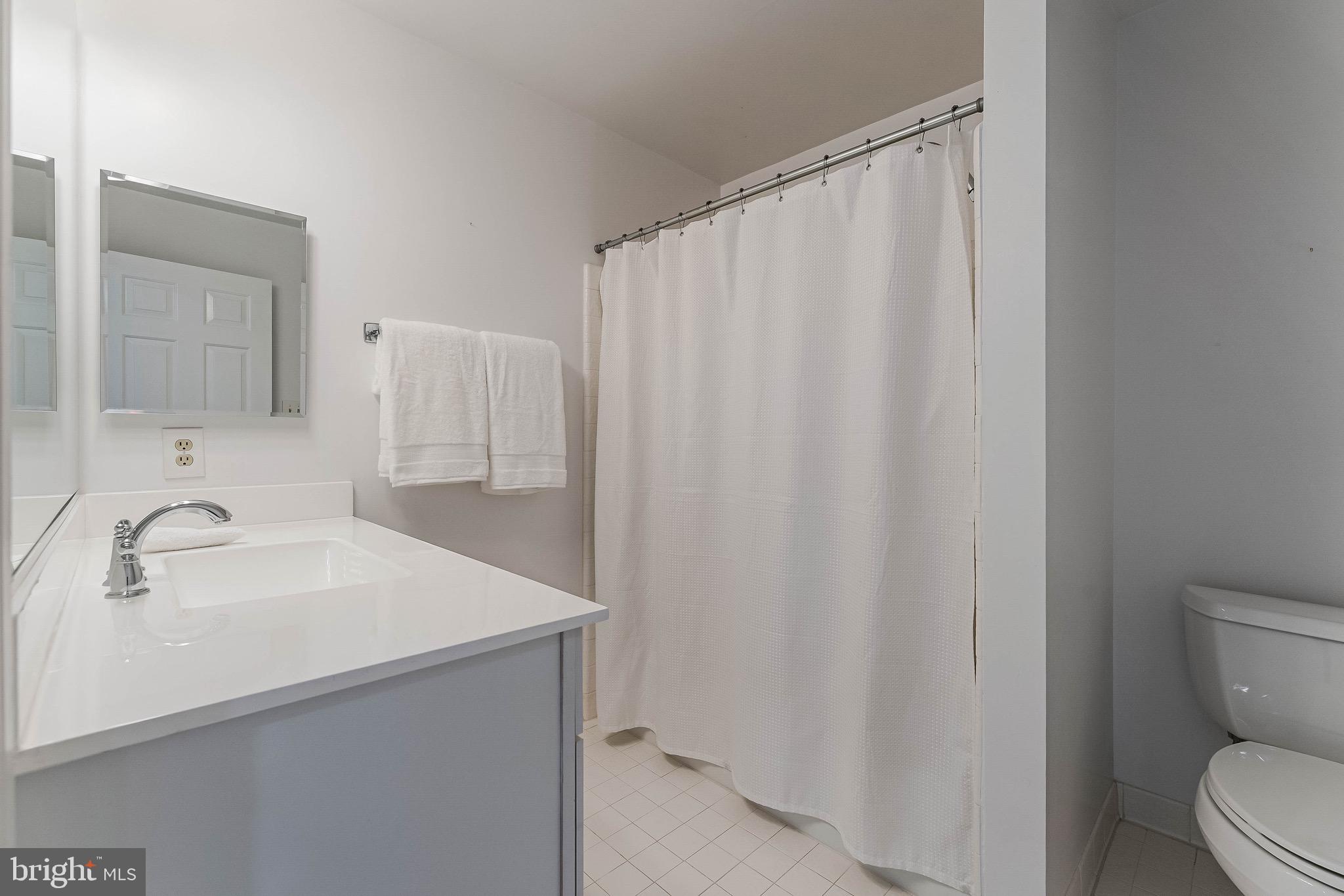 1210 Windrock Drive McLean, VA 22102 - Photo 52 of 84 a bathroom with a sink and a mirror