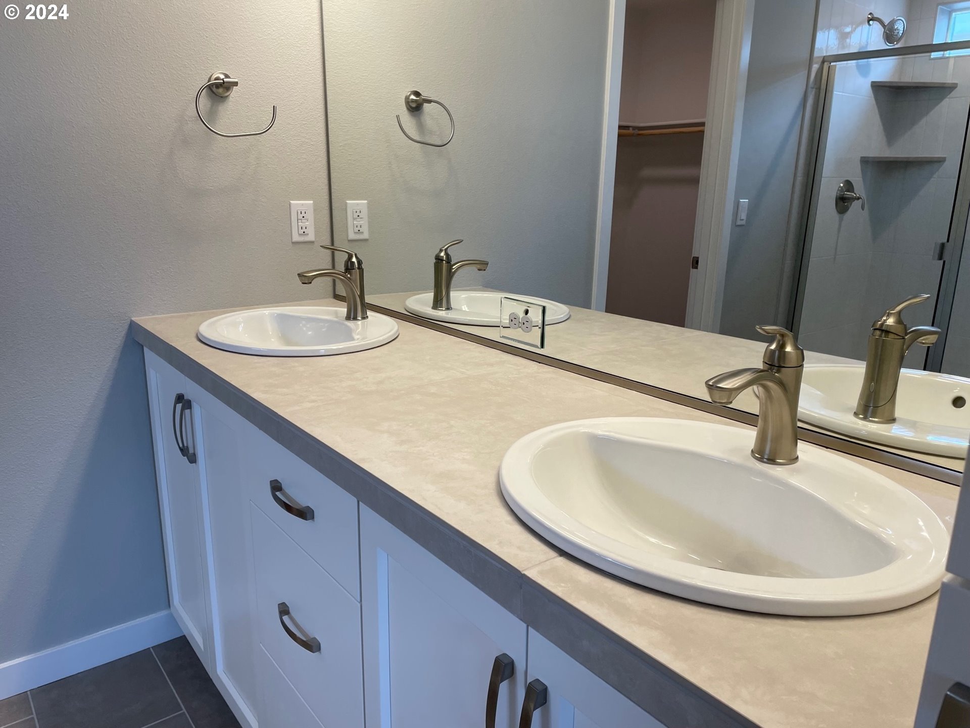 20735 Southwest Boyd Court, Unit 10 Beaverton, OR 97003 - Photo 14 of 47 a bathroom with a sink and a mirror