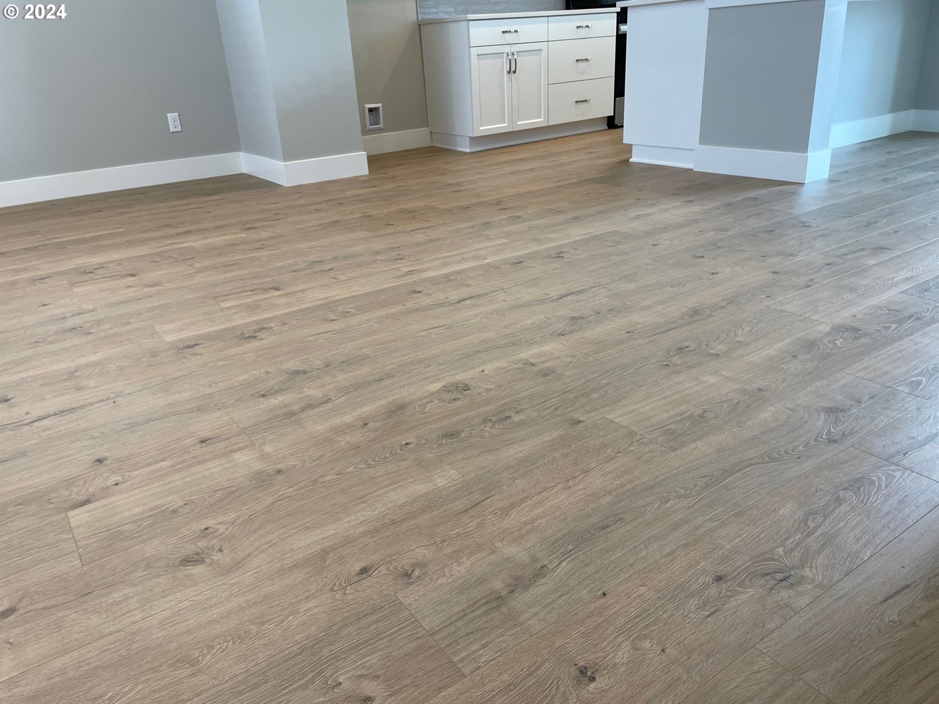 20735 Southwest Boyd Court, Unit 10 Beaverton, OR 97003 - Photo 3 of 47 a view of a room with wooden floor