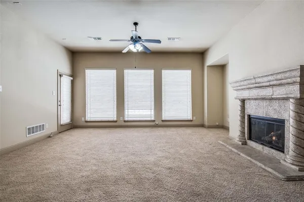 a kitchen with stainless steel appliances granite countertop a sink a stove and refrigerator