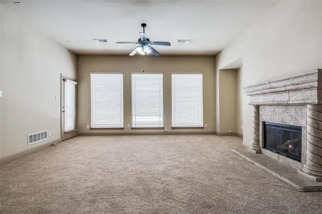 a kitchen with stainless steel appliances granite countertop a sink a stove and refrigerator