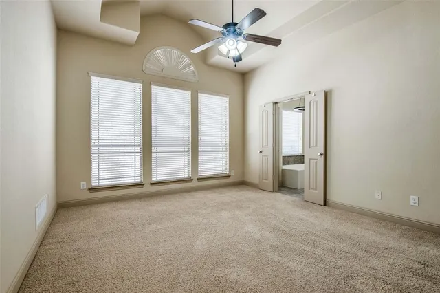 a spacious bathroom with a bathtub sink and mirror