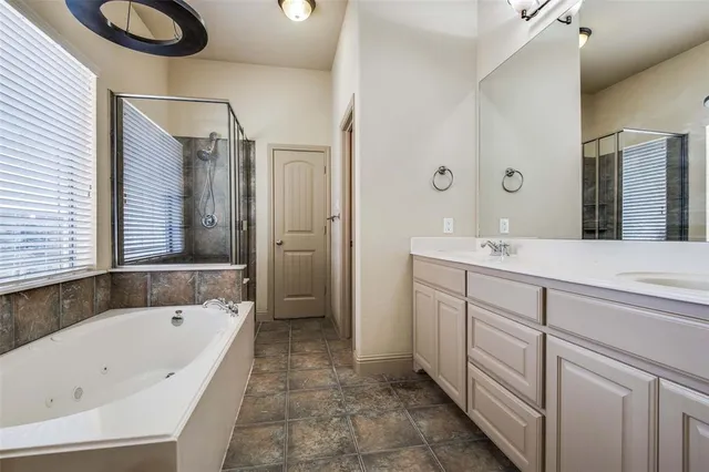 a bathroom with a bathtub and a sink