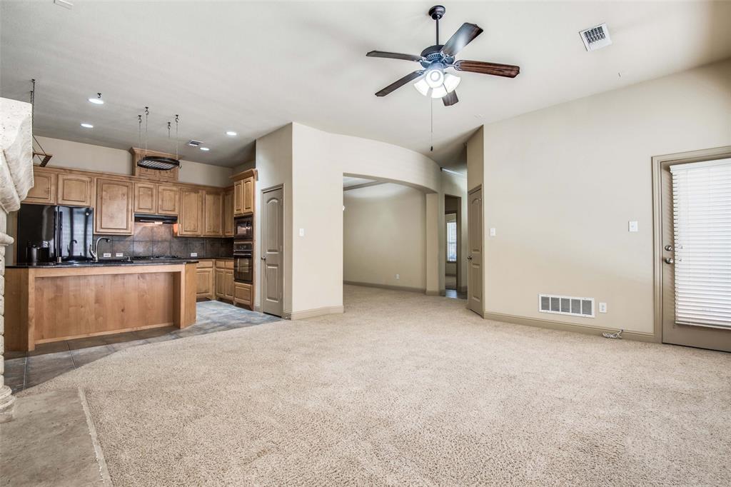 6781 Camino Rio Irving, TX 75039 - Photo 7 of 25 a view of kitchen with stainless steel appliances granite countertop a refrigerator a sink dishwasher and a stove