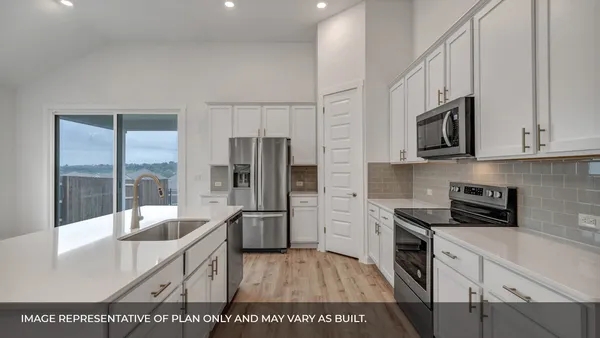 a kitchen with sink cabinets and window