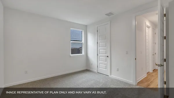a kitchen with granite countertop white cabinets and stainless steel appliances