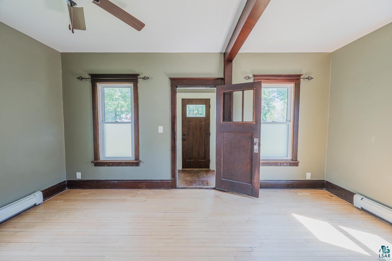 508 10th Street South Virginia, MN 55792 - Photo 3 of 43 Open interior space featuring light wood-finish flooring