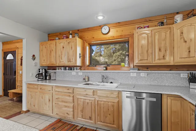 a kitchen with stainless steel appliances granite countertop a sink and cabinets