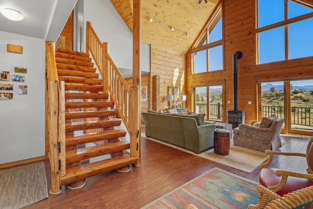 a view of an entryway with wooden floor and windows
